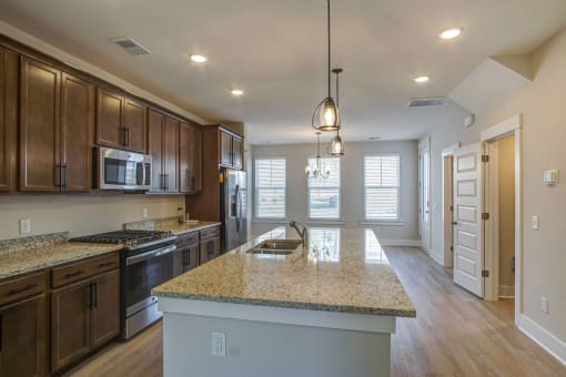 a kitchen with a counter top and a sink