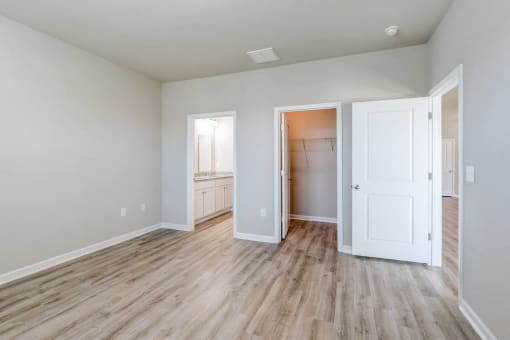 a renovated living room with white walls and wood floors