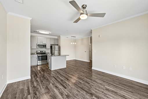 Contemporary Hawks Landing apartment kitchen showcasing stainless-steel appliances and an open-concept island