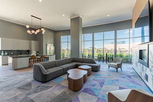 A modern living room with a grey sofa and a wooden coffee table.