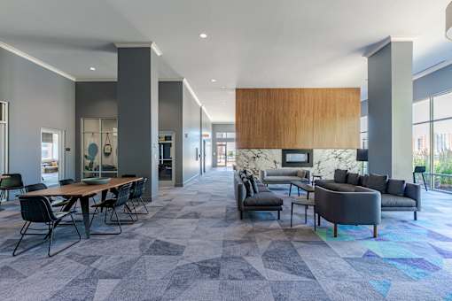 A modern living room with a dining table and a couch.