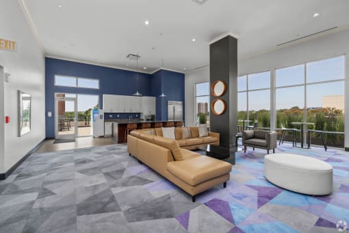 a large living room with couches and a table