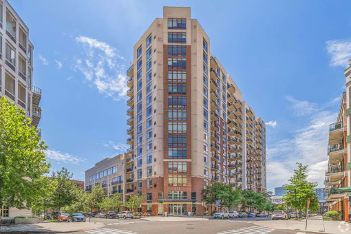 a view of a tall building on a city street