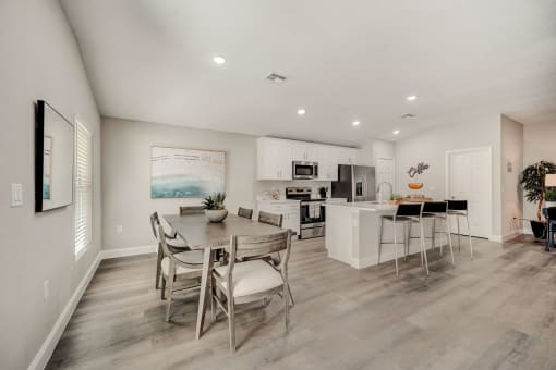 Pet-Friendly Rentals in Lady Lake, FL – The Groves at Lake Ella - dining room and kitchen with a table and chairs