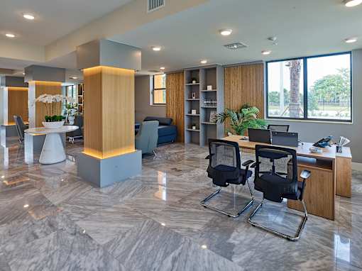 Interior of the club room at Gateway Luxury Apartments featuring comfortable seating and modern décor.