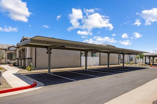 A parking lot with a building in the background.