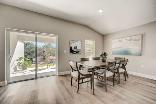 Lady Lake, FL Rentals – The Groves at Lake Ella - a dining room with patio doors and a table and chairs