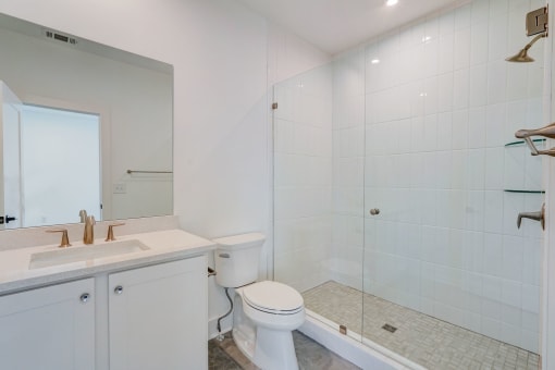 Luxury Three Bedroom Townhomes in Avondale Estates, GA – Henley Avondale –white bathroom with a shower toilet and sink