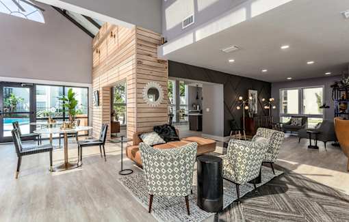 A modern living room with a wooden pillar and a skylight.