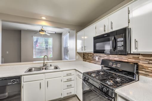 Madison at Black Mountain apartments photo of a updated kitchen with black appliances