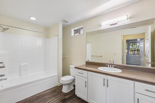 A bathroom with a white toilet and sink.