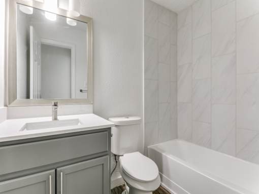 a bathroom with a sink toilet and bathtub