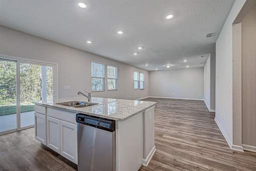 a kitchen with a sink and a dishwasher