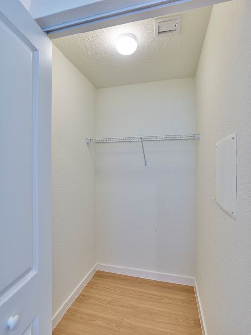 Closet space in a Gateway Luxury Apartment in Pompano Beach, featuring ample storage.