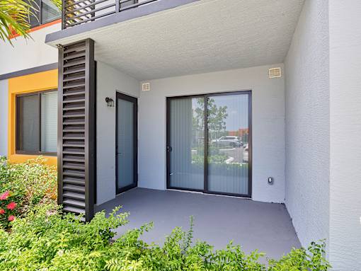 Cozy outdoor patio area at Gateway Luxury Apartments, ideal for enjoying fresh air and sunsets.