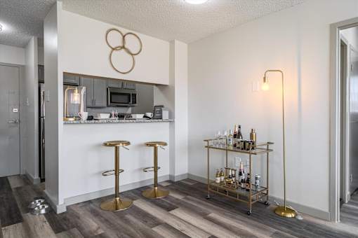 Kitchen and dining area at Idlewild 45 Apartments in Memphis featuring breakfast bar and stainless steel appliances
