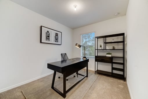 Boatman Hammock Townhomes in Lake Worth, FL photo of  a home office with a desk and a bookshelf