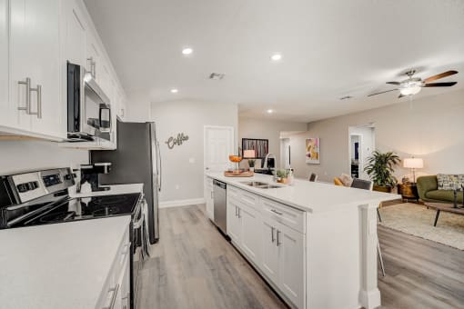 Pet-Friendly Rentals in Lady Lake, FL – The Groves at Lake Ella - luxury kitchen with white cabinets and hardwood floors