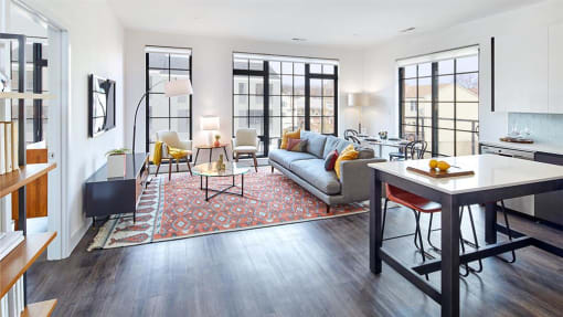 Living room with floor to ceiling windows and modern furniture