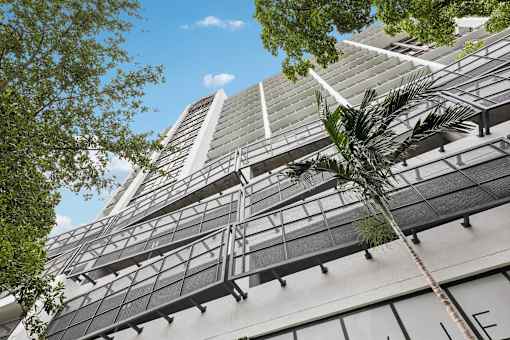 Contemporary high-rise architecture at MB Station in Coral Way, Miami, featuring modern apartment living with convenient access to Downtown Miami, Brickell, and Coral Gables.