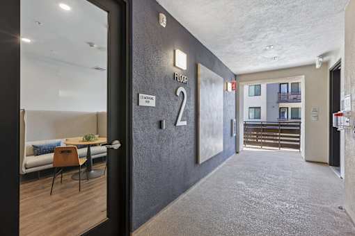 A hallway with a number 2 on the wall.
