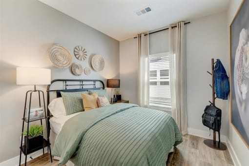 a bedroom with a bed and a window