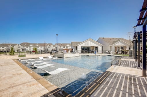 a swimming pool with a building in the background