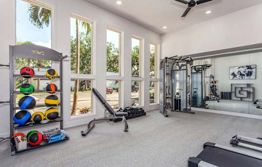 A well-equipped home gym with a variety of exercise equipment.