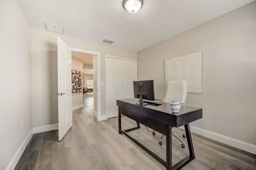 Lady Lake, FL Rentals – The Groves at Lake Ella - an office space with desk and chair.