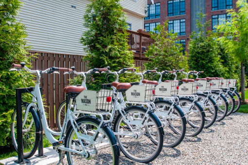 a row of bikes parked in front of a building