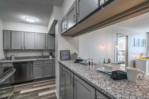 Kitchen at Idlewild 45 Apartments in Memphis TN featuring granite countertops and stainless steel appliances