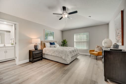 Houses in Lady Lake for Rent – The Groves at Lake Ella - a bedroom with a bed and a ceiling fan