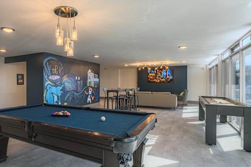 Resident game room at Idlewild 45 Apartments featuring pool table and social lounge space