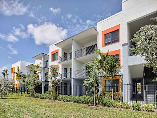Stylish apartment building exterior at Gateway Luxury Apartments with clean lines and large windows.