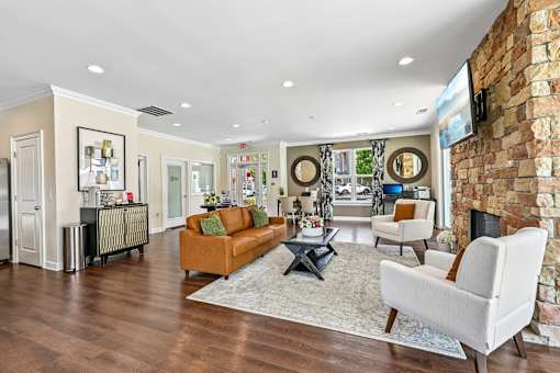 A stylish Hawks Landing clubhouse in Hickory NC with a fireplace and inviting lounge area