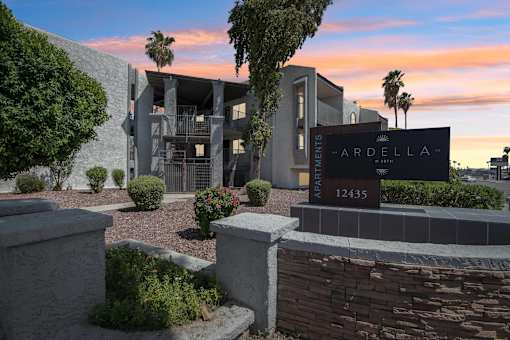 The image shows a modern building with a sign that reads "ARDELLA 12435".