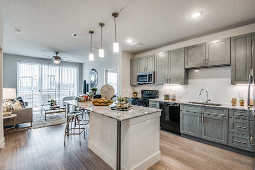 A modern kitchen with a large island in the center.
