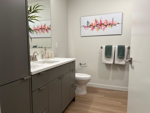 an open bathroom with a sink and a toilet