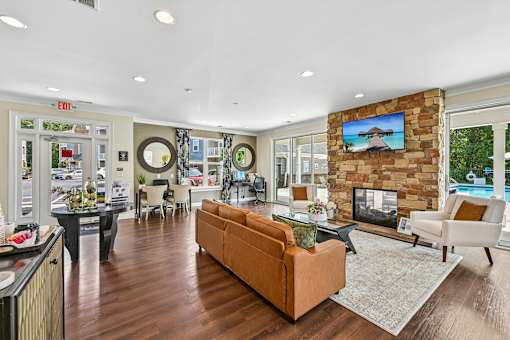 A modern Hawks Landing clubroom in Hickory NC featuring a cozy fireplace and comfortable seating