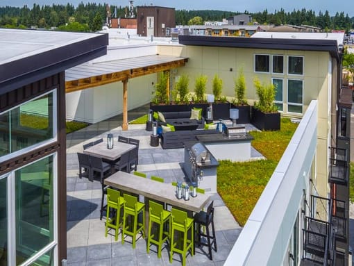 Urban Studio Apartments in Seattle, WA - Origin - Rooftop Patio with City View, Fire-Pit, Barbecue Grills, and Lounge Seating