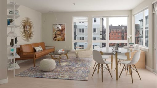 Apartments in Seattle, WA, with In-Unit Washer and Dryer - Origin - Open Layout Living Room with Contemporary Wood-Finish Flooring, Area Rug, Sofa, Ottoman, Armchair, Glass-Top Coffee Table, Shelf with Books and Decors, Wall Art, Decorative Floor Lamp, 4-Seater Dinette, and Large Windows with City Views