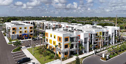 Wide shot of Gateway Luxury Apartments showing exterior architecture and convenient resident parking.