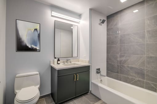 3thirty3 new rochelle ny apartment high rise photo of bathroom with vanity and tub shower