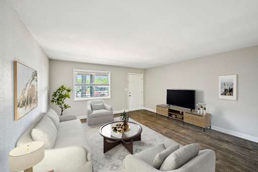 Living room in pet-friendly Marietta GA apartment with bright windows and neutral colors