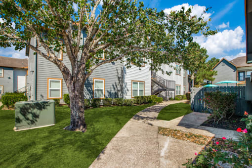 Outside of Breakwater Bay apartments with pathway for walking