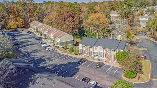Element at 4411 Macon Apartments A parking lot with a building in the background.