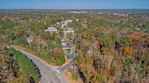 Element at 4411 Macon Apartments A road with a curve and a crosswalk in the middle of it.