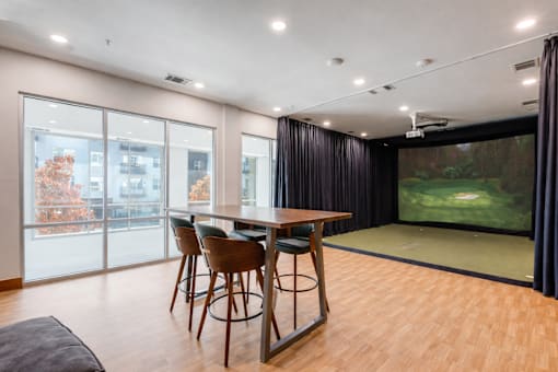 A modern dining room with a large table and chairs.