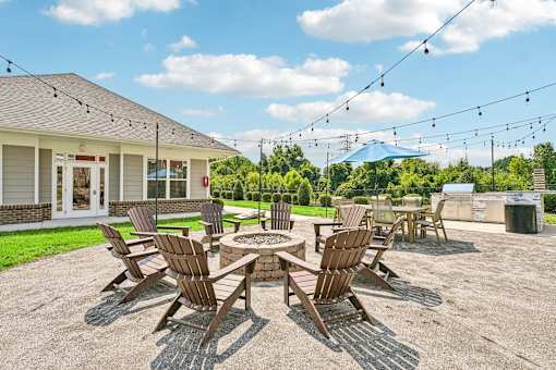 A fire pit area at Hawks Landing in Hickory NC featuring seating and warm ambient lighting for residents to enjoy