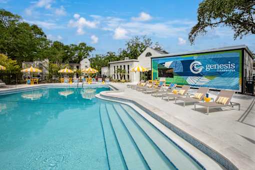 A large swimming pool with a Genesis sign in the background.
